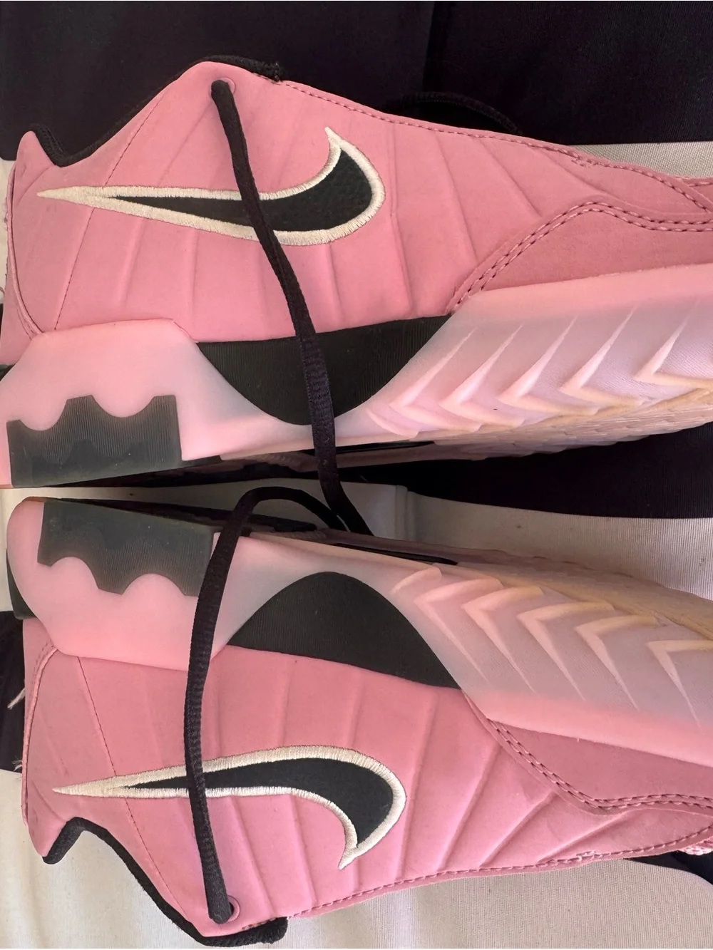 Nike Pink and Black basketball sneaker with White Swoosh